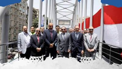 البنك الأهلي يفتتح كوبري مشاة جديد بالدقي