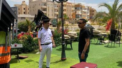 جهاز مدينة حدائق أكتوبر يزيل إشغالات طريق زويل والمولات المخالفة