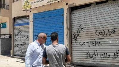 جهاز مدينة حدائق العاصمة يسحب 6 محلات تجارية لعدم سداد المستحقات